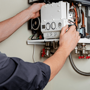 Plumber fixing heater